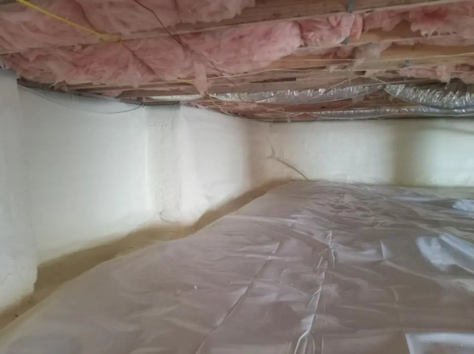 Crawl space encapsulation with closed-cell spray foam for Commercial Roof Restoration in Charlotte